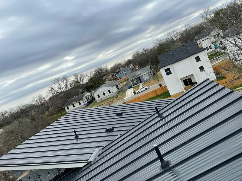 Standing seam metal roof panels with vents for Skylight Repair in Englewood